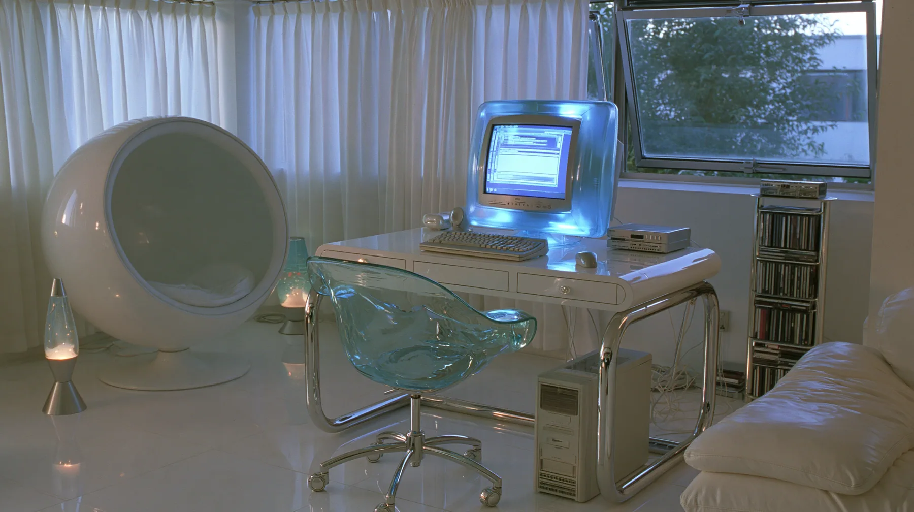 Y2K high fashion editorial photograph, 2001: an interior photograph of a 2001 high-fashion minimalist white loft apartment with molded white plastic furniture, a white lacquer desk, chrome and translucent ice-blue…