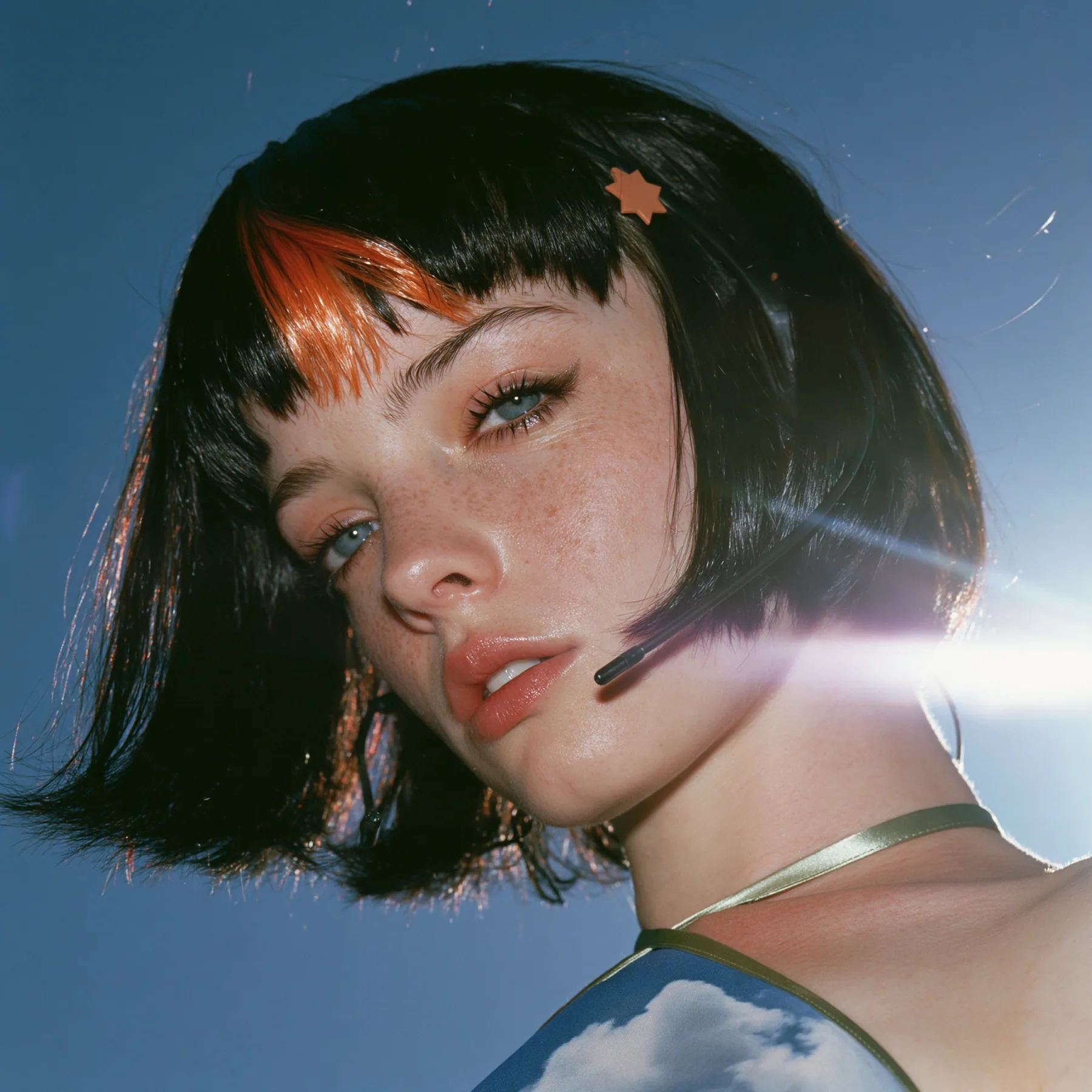 Y2K high fashion editorial, a 2001 couture magazine story: a square album cover photograph of a Caucasian American woman in her mid-twenties with pale skin and light freckles, a glossy black blunt jaw-length bob with…